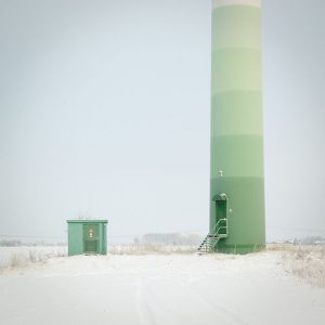 wind turbine towers with vertical colored painting on it